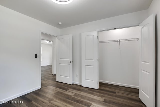 181 Lakeshore Ln, Decatur, TN 37322 - unfurnished bedroom with dark wood finished floors and a closet