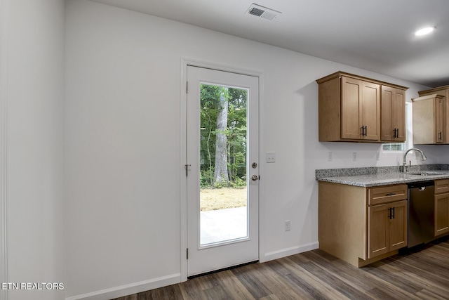 181 Lakeshore Ln, Decatur, TN 37322 - kitchen with stainless steel dishwasher, dark wood finished floors, light stone countertops, and brown cabinets