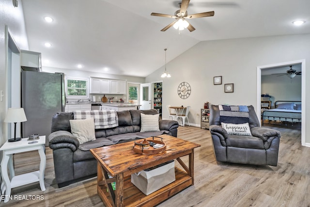2296 Memory Garden Rd, Jamestown, TN 38556 - living room featuring ceiling fan, vaulted ceiling, light wood-style flooring, and recessed lighting