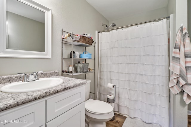 2296 Memory Garden Rd, Jamestown, TN 38556 - full bathroom featuring vanity, wood finished floors, and a shower with shower curtain