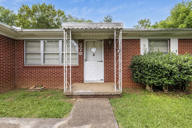 776 Hamilton St, Alcoa, TN 37701 - view of exterior entry featuring brick siding