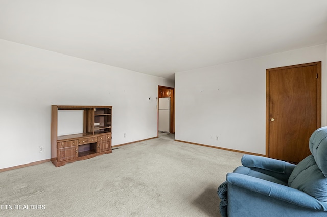 776 Hamilton St, Alcoa, TN 37701 - living room featuring light carpet and baseboards
