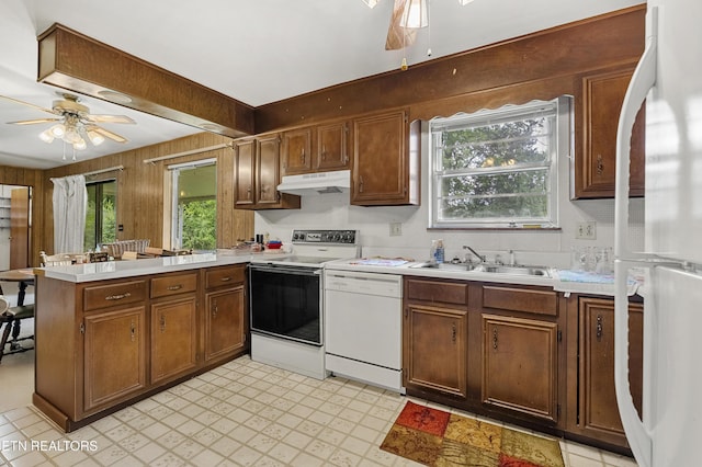 776 Hamilton St, Alcoa, TN 37701 - kitchen with white appliances, ceiling fan, a peninsula, under cabinet range hood, and light countertops