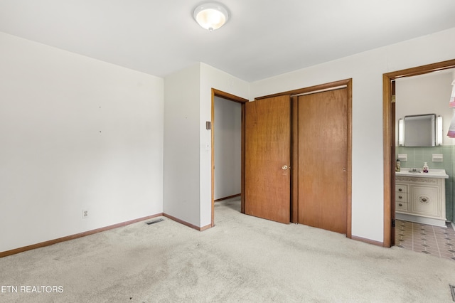 776 Hamilton St, Alcoa, TN 37701 - unfurnished bedroom with carpet, a closet, and ensuite bath