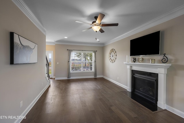 107 Cedarberry St, Oak Ridge, TN 37830 - unfurnished living room with crown molding, a ceiling fan, dark wood-type flooring, and a glass covered fireplace