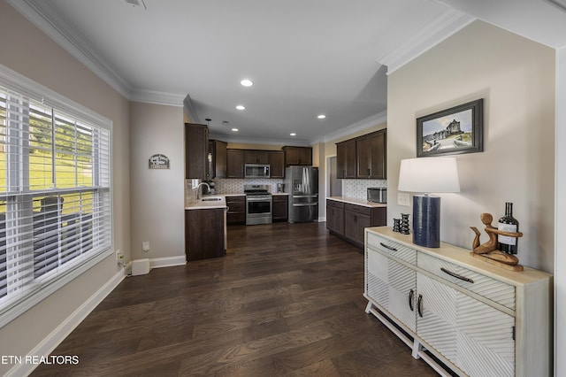 107 Cedarberry St, Oak Ridge, TN 37830 - kitchen featuring stainless steel appliances, light countertops, dark brown cabinetry, crown molding, and recessed lighting