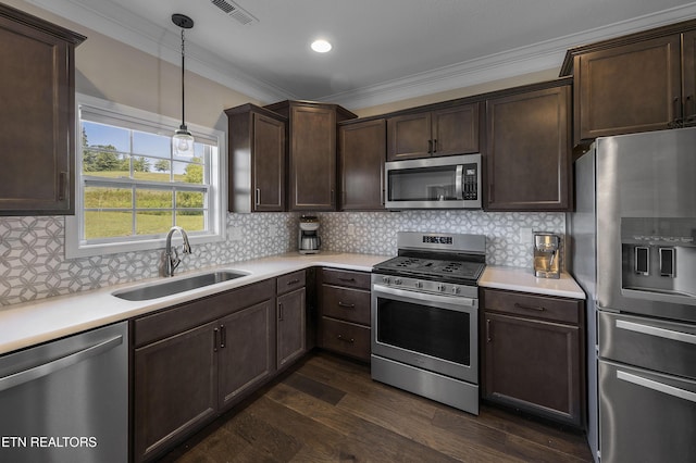 107 Cedarberry St, Oak Ridge, TN 37830 - kitchen featuring stainless steel appliances, ornamental molding, dark brown cabinetry, light countertops, and recessed lighting