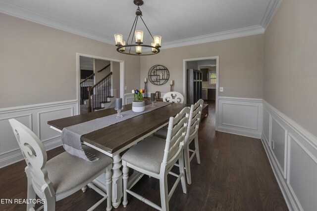 107 Cedarberry St, Oak Ridge, TN 37830 - dining room featuring stairs, a chandelier, a wainscoted wall, a decorative wall, and crown molding