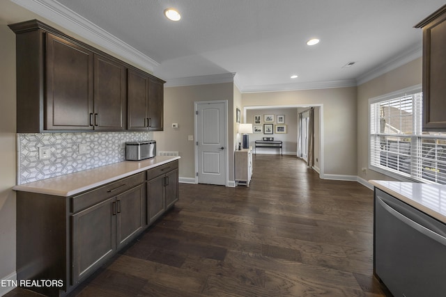 107 Cedarberry St, Oak Ridge, TN 37830 - kitchen with stainless steel dishwasher, ornamental molding, light countertops, dark brown cabinetry, and recessed lighting