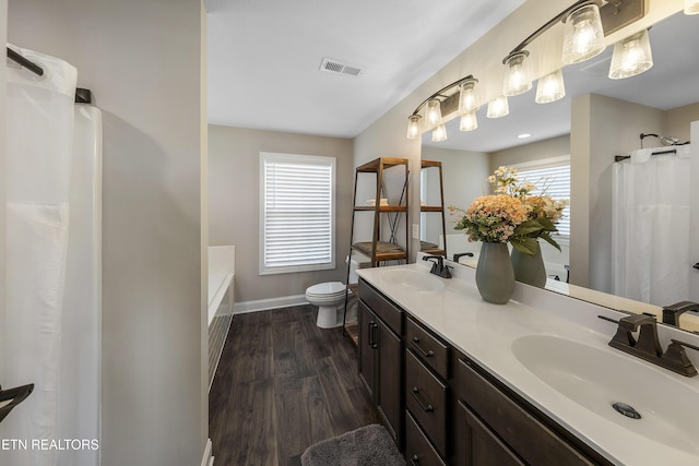 107 Cedarberry St, Oak Ridge, TN 37830 - bathroom featuring double vanity, wood finished floors, and a bath