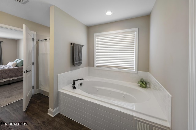 107 Cedarberry St, Oak Ridge, TN 37830 - ensuite bathroom featuring a whirlpool tub, wood finished floors, and a shower stall