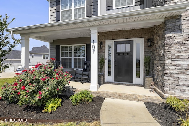 107 Cedarberry St, Oak Ridge, TN 37830 - view of exterior entry featuring a porch and stone siding