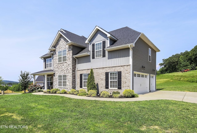 107 Cedarberry St, Oak Ridge, TN 37830 - view of front facade featuring an attached garage, driveway, a front lawn, board and batten siding, and stone siding