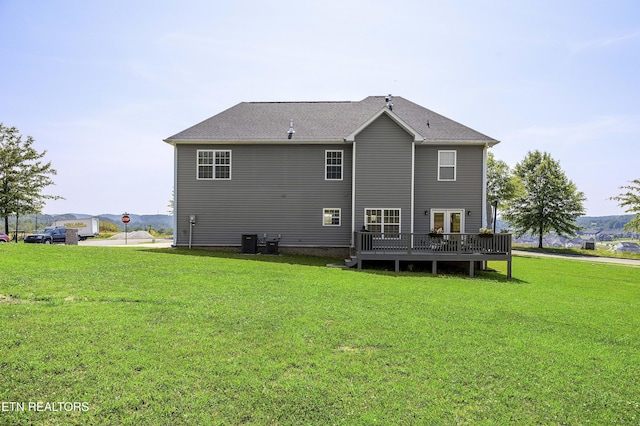 107 Cedarberry St, Oak Ridge, TN 37830 - back of house featuring a wooden deck and a lawn