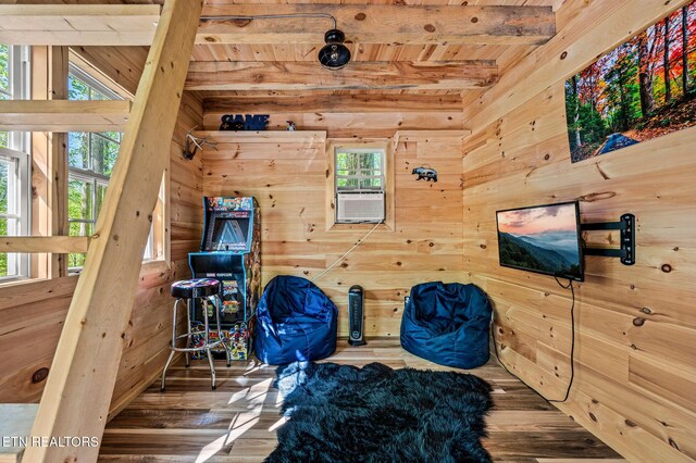 3721 Clabo Mountain Ln, Sevierville, TN 37862 - sitting room featuring wood walls, a wood ceiling with exposed beams, wood finished floors, plenty of natural light, and cooling unit