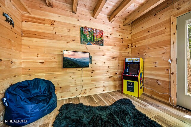 3721 Clabo Mountain Ln, Sevierville, TN 37862 - rec room featuring a wooden ceiling with exposed beams, wooden walls, and wood finished floors