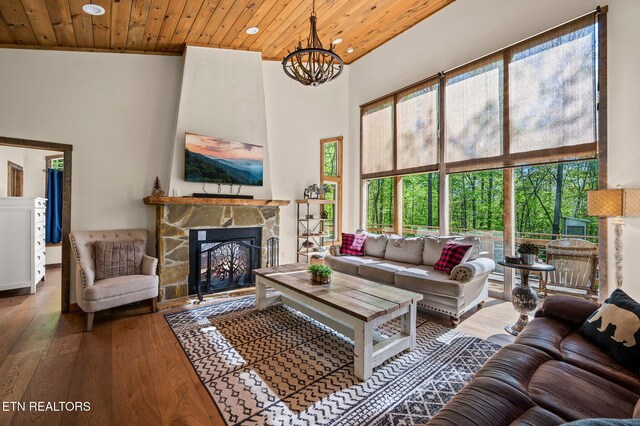 3721 Clabo Mountain Ln, Sevierville, TN 37862 - living room with a high ceiling, hardwood / wood-style flooring, a fireplace, recessed lighting, and a chandelier