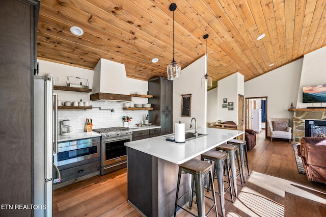 3721 Clabo Mountain Ln, Sevierville, TN 37862 - kitchen featuring stainless steel appliances, open shelves, premium range hood, light countertops, and wood ceiling