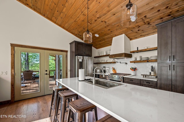 3721 Clabo Mountain Ln, Sevierville, TN 37862 - kitchen featuring custom range hood, open shelves, premium appliances, wood ceiling, and dark brown cabinets