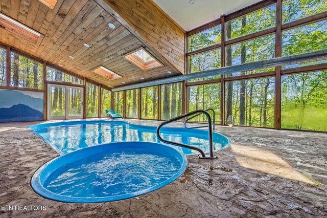 3721 Clabo Mountain Ln, Sevierville, TN 37862 - view of pool featuring a skylight and a pool with connected hot tub