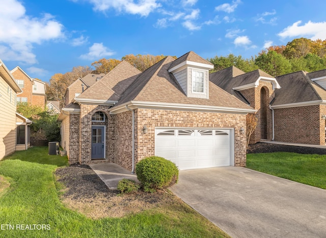1036 Gothic Manor Way, Knoxville, TN 37923 - view of front of property with brick siding, a garage, a front lawn, and driveway