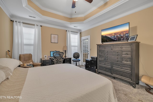 1036 Gothic Manor Way, Knoxville, TN 37923 - carpeted bedroom featuring ornamental molding, a raised ceiling, a ceiling fan, and an office area