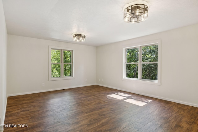 142 Campbell Way, Newport, TN 37821 - empty room with healthy amount of natural light, dark wood finished floors, and a chandelier