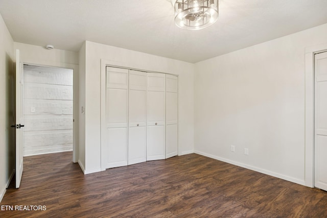 142 Campbell Way, Newport, TN 37821 - unfurnished bedroom with dark wood finished floors, a chandelier, and a closet