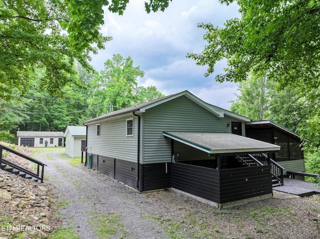 149 Giles Rd, Cosby, TN 37722 - rear view of property with a sunroom and stairway
