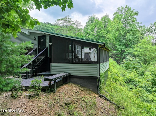 149 Giles Rd, Cosby, TN 37722 - view of property exterior with a sunroom and a wooden deck