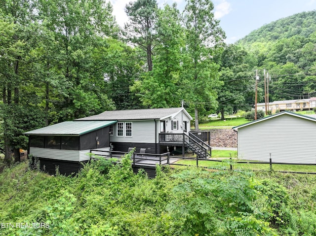 149 Giles Rd, Cosby, TN 37722 - back of house with a wooden deck, a sunroom, stairway, and a view of trees