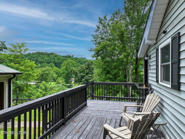 149 Giles Rd, Cosby, TN 37722 - wooden deck with a wooded view