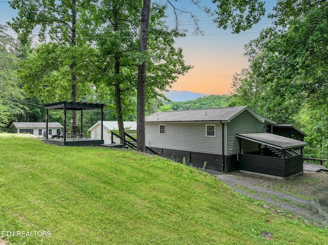 149 Giles Rd, Cosby, TN 37722 - back of property at dusk featuring a lawn