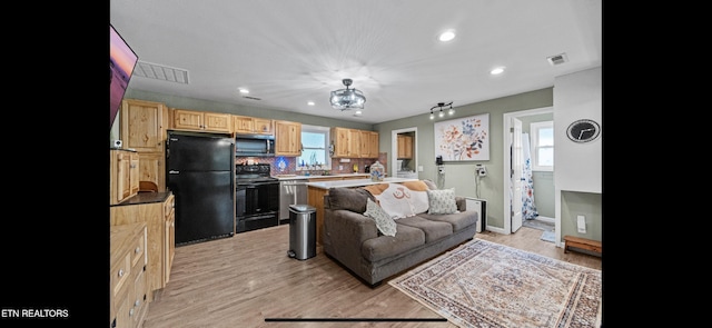 149 Giles Rd, Cosby, TN 37722 - living area with recessed lighting, light wood-style flooring, and a chandelier