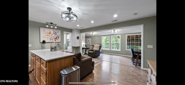 149 Giles Rd, Cosby, TN 37722 - kitchen with wood finished floors, recessed lighting, light countertops, open floor plan, and brown cabinets