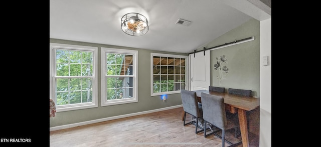 149 Giles Rd, Cosby, TN 37722 - home office featuring vaulted ceiling, a barn door, and wood finished floors