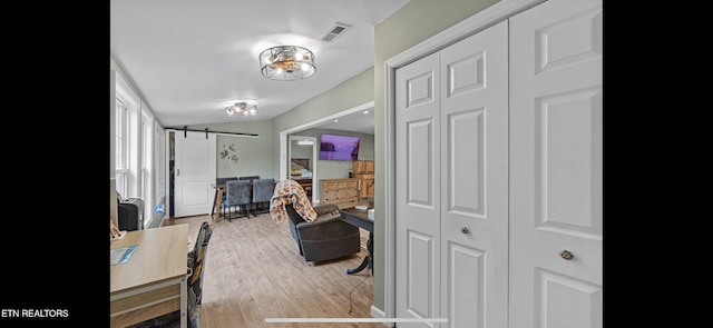 149 Giles Rd, Cosby, TN 37722 - hall featuring a barn door and wood finished floors