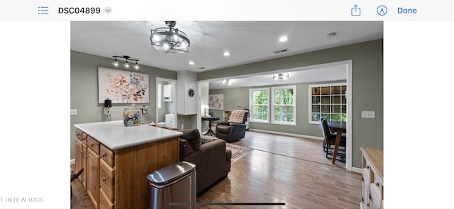 149 Giles Rd, Cosby, TN 37722 - kitchen with wood finished floors, brown cabinets, recessed lighting, light countertops, and open floor plan