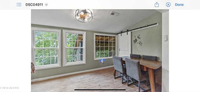 149 Giles Rd, Cosby, TN 37722 - home office with wood finished floors, vaulted ceiling, and a barn door