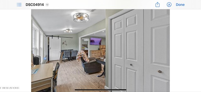149 Giles Rd, Cosby, TN 37722 - hall featuring a barn door and wood finished floors