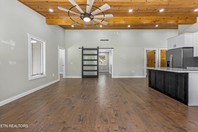11325 New Highway 68, Tellico Plains, TN 37385 - unfurnished living room featuring wood ceiling, a high ceiling, a barn door, recessed lighting, and dark wood-style floors