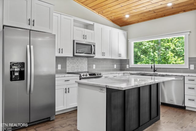 11325 New Highway 68, Tellico Plains, TN 37385 - kitchen with appliances with stainless steel finishes, wood ceiling, white cabinetry, lofted ceiling, and a center island