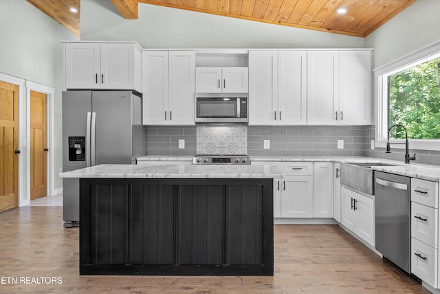 11325 New Highway 68, Tellico Plains, TN 37385 - kitchen with appliances with stainless steel finishes, lofted ceiling, a center island, wood ceiling, and tasteful backsplash