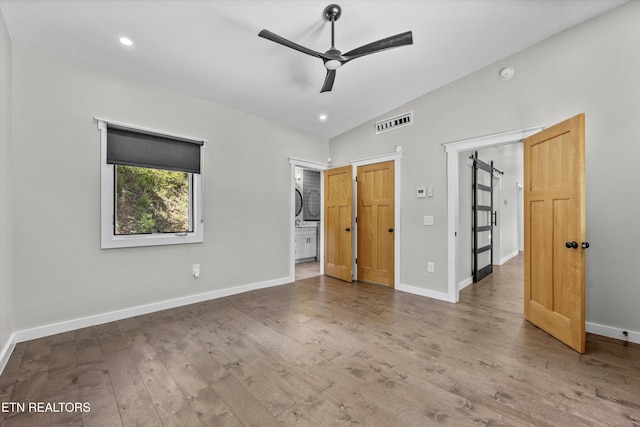 11325 New Highway 68, Tellico Plains, TN 37385 - unfurnished bedroom featuring wood finished floors, lofted ceiling, recessed lighting, and ensuite bathroom