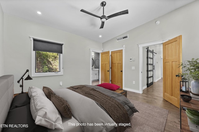 11325 New Highway 68, Tellico Plains, TN 37385 - bedroom featuring wood finished floors, vaulted ceiling, recessed lighting, ensuite bath, and a ceiling fan