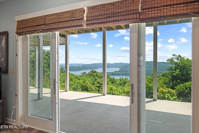 61 Brim Ln, Hilham, TN 38568 - doorway with a water and mountain view and healthy amount of natural light