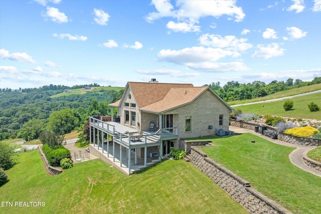 61 Brim Ln, Hilham, TN 38568 - back of house with a wooden deck, a lawn, a patio area, and stone siding