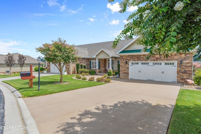 404 Chota Landing Way, Loudon, TN 37774 - view of front facade featuring stone siding, driveway, a garage, and a front yard