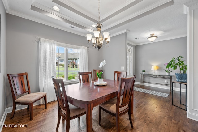 404 Chota Landing Way, Loudon, TN 37774 - dining area with dark wood-style flooring, crown molding, a chandelier, and a tray ceiling