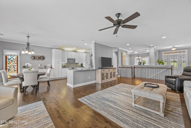 404 Chota Landing Way, Loudon, TN 37774 - living area featuring a chandelier, crown molding, recessed lighting, ceiling fan, and dark wood-style flooring